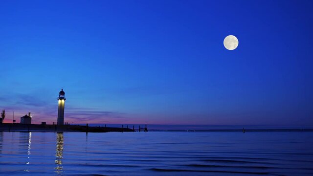 Beautiful night view of the lighthouse in Hellevoetsluis, South Holland, Netherlands in summer moonlight