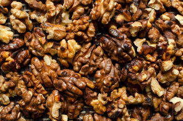 Top view of toasted walnuts as a background.Ingredient for tasty pastry