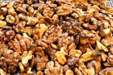 Closeup of dried and toasted walnuts as a background 
