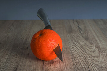 orange hit by flying knife