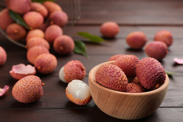 Fresh ripe lychee fruits on wooden table