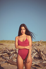 Obraz premium Portrait of natural beauty young woman in retro swimwear at the beach on summer vacation.