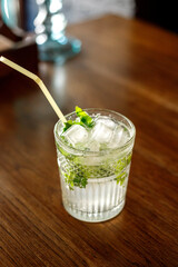 Fresh mojito cocktail on the table in the bar. Cool tropical cocktail.