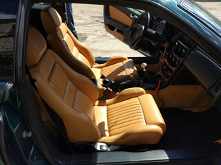 Light leather interior of a sports car.