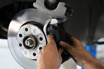 Brake pad replacement in car service © Ahmet Burcak Gozcu
