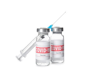 Vials with vaccine against coronavirus and syringe on white background