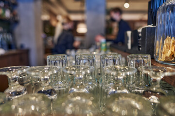 Empty and clean cocktail glasses at the bar.