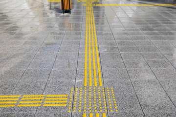 Bright yellow tactile paving for the visually impaired