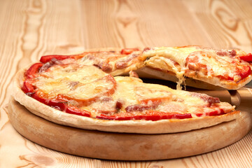 Bright juicy tasty pizza. two floors. Lots of cheese and tomato. Side view.