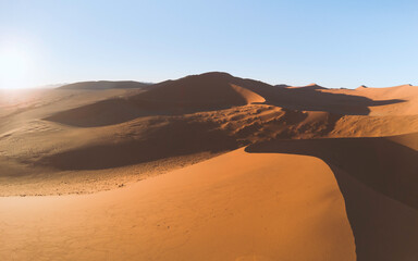 Fototapeta na wymiar Sand dunes in the desert at sunrise in Namibia