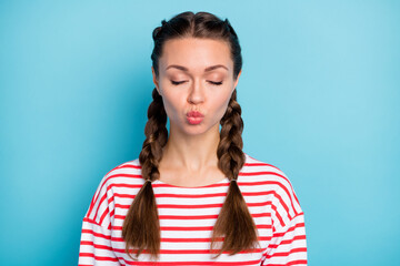 Photo of flirty sweet young woman dressed striped shirt closed eyes lips pouted isolated blue color background