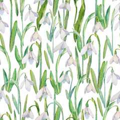 Vector seamless pattern with watercolor snowdrops. A repeating background with the first spring flowers on white