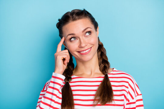 Photo of cute thoughtful young lady wear red shirt finger head looking empty space isolated pastel blue color background