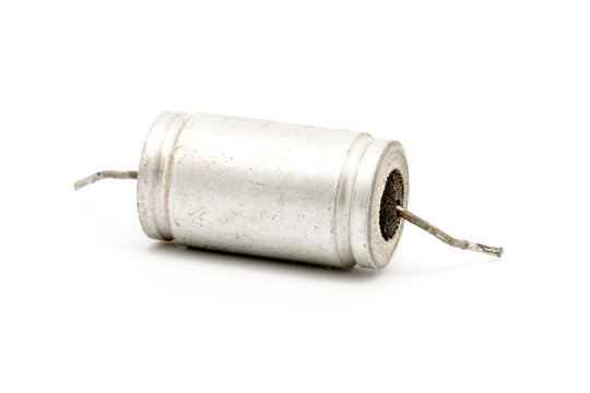 faulty metal-paper capacitors. paper small-sized heat-resistant capacitor. Defective retro capacitors removed for replacement. isolated on white base