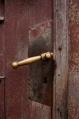 Antique door with a lock. Doorhandle. 