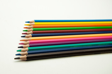 colored pencils on a white background. education concept. illustration of training.