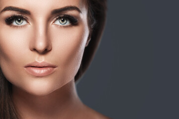 Fototapeta premium Portrait of young and pretty woman with a artificial eyelashes