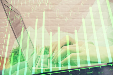 Multi exposure of woman hands typing on computer and forex chart hologram drawing. Stock market analysis concept.