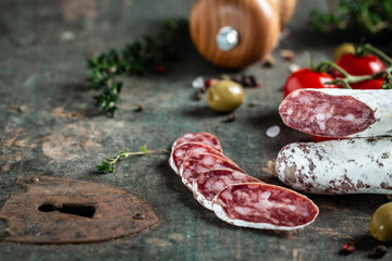 Fuet, Salami. Traditional Spanish sausage on wooden background. Food recipe background. space for text. top view