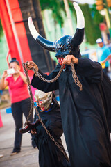 Masaya, Nicaragua; October 29, 2017: Nicaraguan people celebrating "La Fiesta de los Agüizotes" in the city of Masaya. Demon costume.