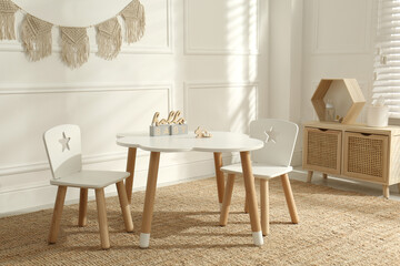 Modern child room interior with stylish furniture and accessories