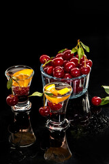 Fresh cocktail with syrup, cherry and orange