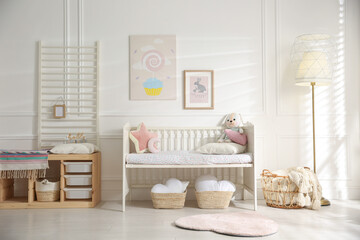 Fototapeta na wymiar Baby room interior with stylish furniture and toys