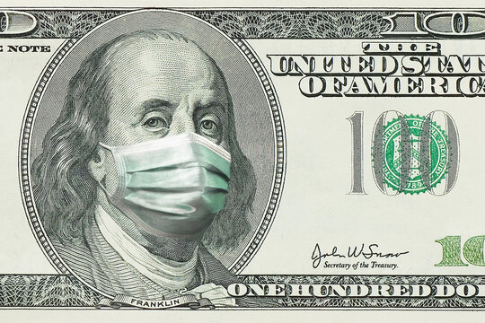 hundred dollar ba$ 100 bills with Benjamin Franklin in a medical mask the coronavirus epidemic of the United States of America. the decline of the United States economy due to tknote,isolated on white