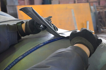 Installation of an X-ray film on a welded seam by a defectoscopist. X-ray inspection of welds at a...