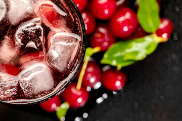 Summer fresh cocktail with soda and syrup and cherry