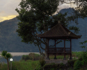 Fototapeta na wymiar Gazebo with Mountain and Lake View in Bali