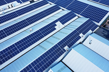Solar panels on a roof of a company Solar panels are a cheap and sustainable way to obtain energy...