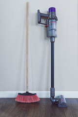 broom and cordless electronic vacuum cleaner