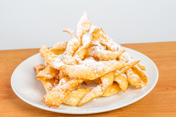 Angel wings with powdered sugar. Polish Faworki and chrusty are the plural forms of the words faworek and chrust respectively.