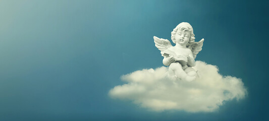 Condolence card. Little angel sitting on the cloud and reading book