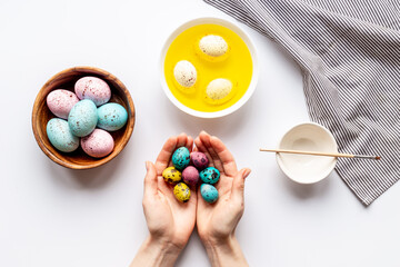 Colored Easter eggs with yellow dye. Top view