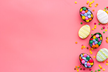 Happy Easter with chocolate eggs and sweets. Space for text