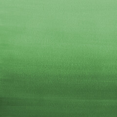 Green ink and watercolor texture on white paper background. Gradient paint strokes and decalcomania effect. Hand-painted gouache abstract image. Mess on the canvas.
