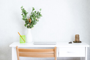  white card mockup and envelope with workspace accessories on a white table.
