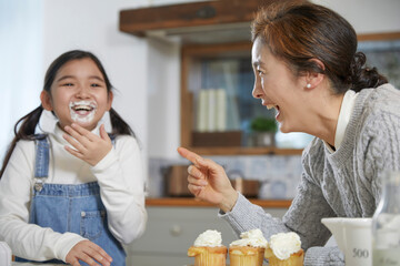 grandmother and granddaughter cooking time