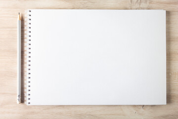 blank notebook on wooden background