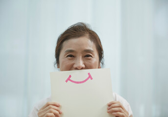 person holding a paper with a message