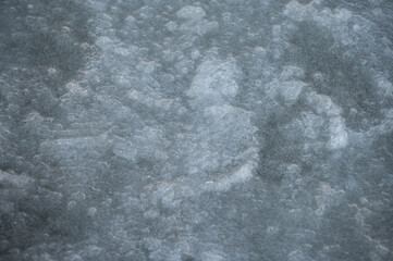 Abstract cold ice texture with bubbles frozen under the surface