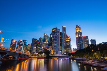Fototapeta na wymiar Wide panorama of Singapore cityscape at magic hour.