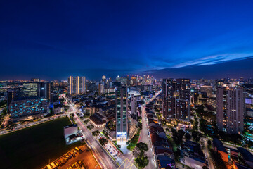 Fototapeta na wymiar Wide panorama of Singapore cityscape at magic hour.