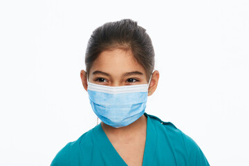 Mixed race girl with a medical protective face mask during a global pandemic, isolated on white