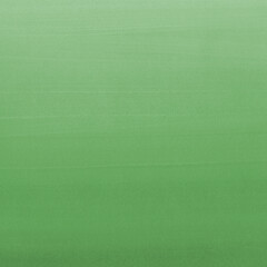 Green ink and watercolor texture on white paper background. Gradient paint strokes and decalcomania effect. Hand-painted gouache abstract image. Mess on the canvas.