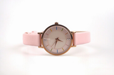 Pink wrist watch on white background