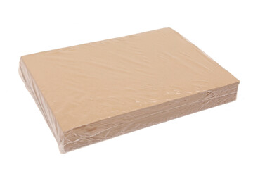 industrial packet of paper sheets in plastic wrapping
