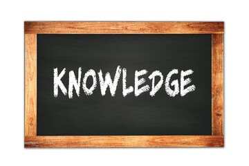 Obraz premium KNOWLEDGE text written on wooden frame school blackboard.